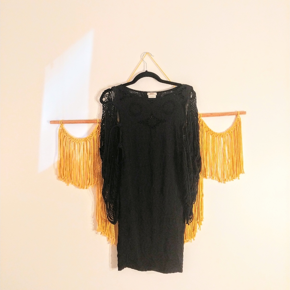 Black bodycon dress with bell sleeves